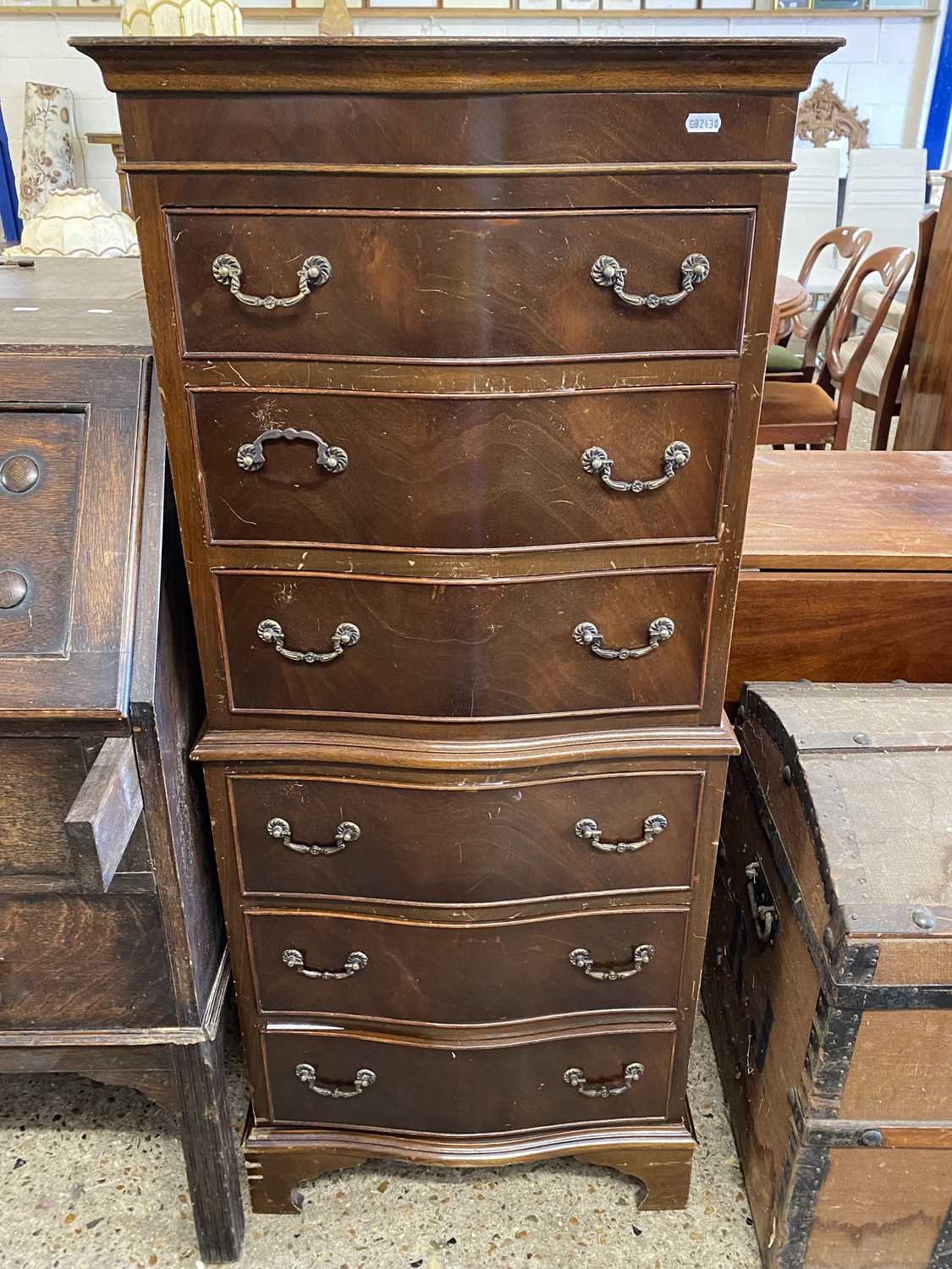 Mahogany veneered serpentine front six drawer chest