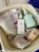 A bottle of Chanel No 5 body lotion and a bottle of Hermes Calach body lotion together with another