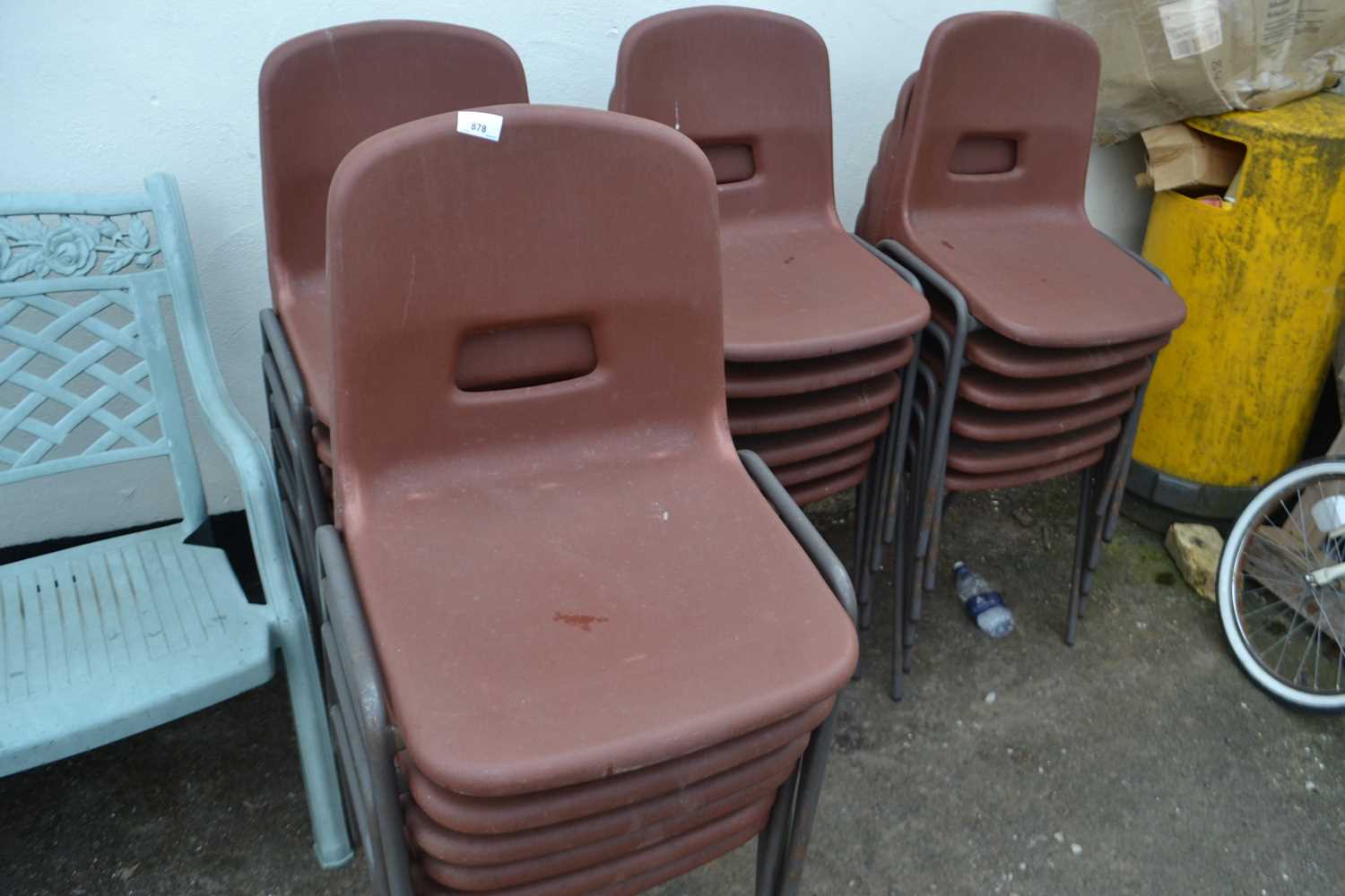 Quantity of brown plastic stacking chairs, approx 24