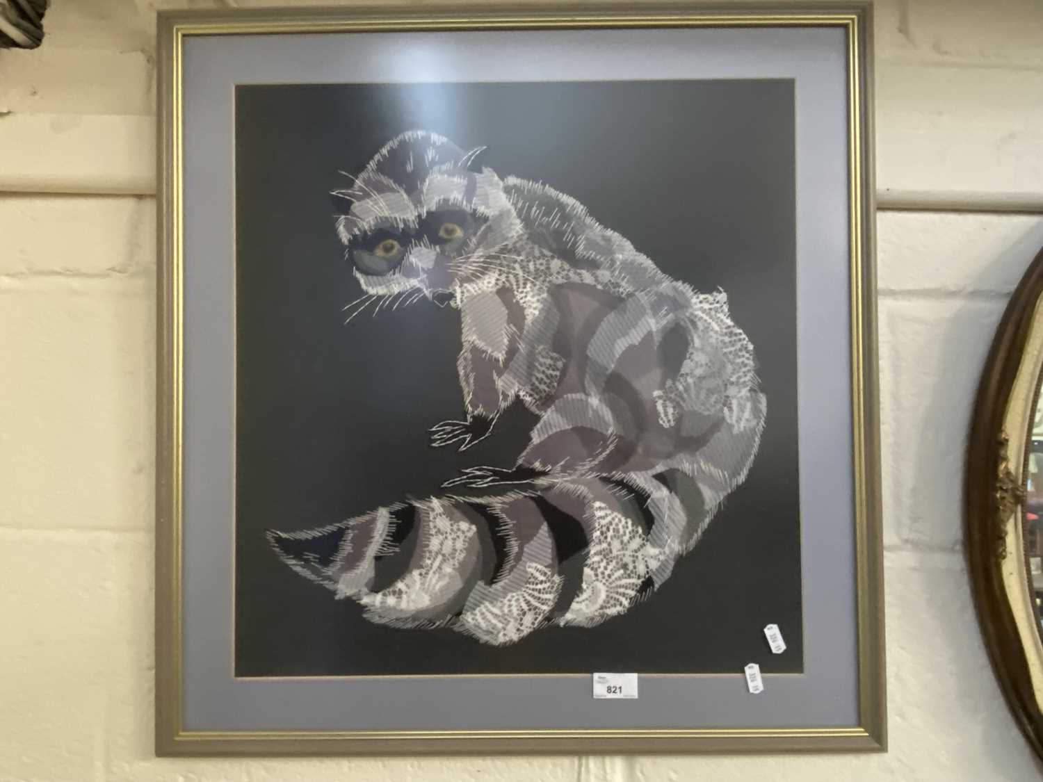 Textile picture of a racoon , framed and glazed