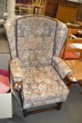 Wooden framed upholstered wing back style easy chair
