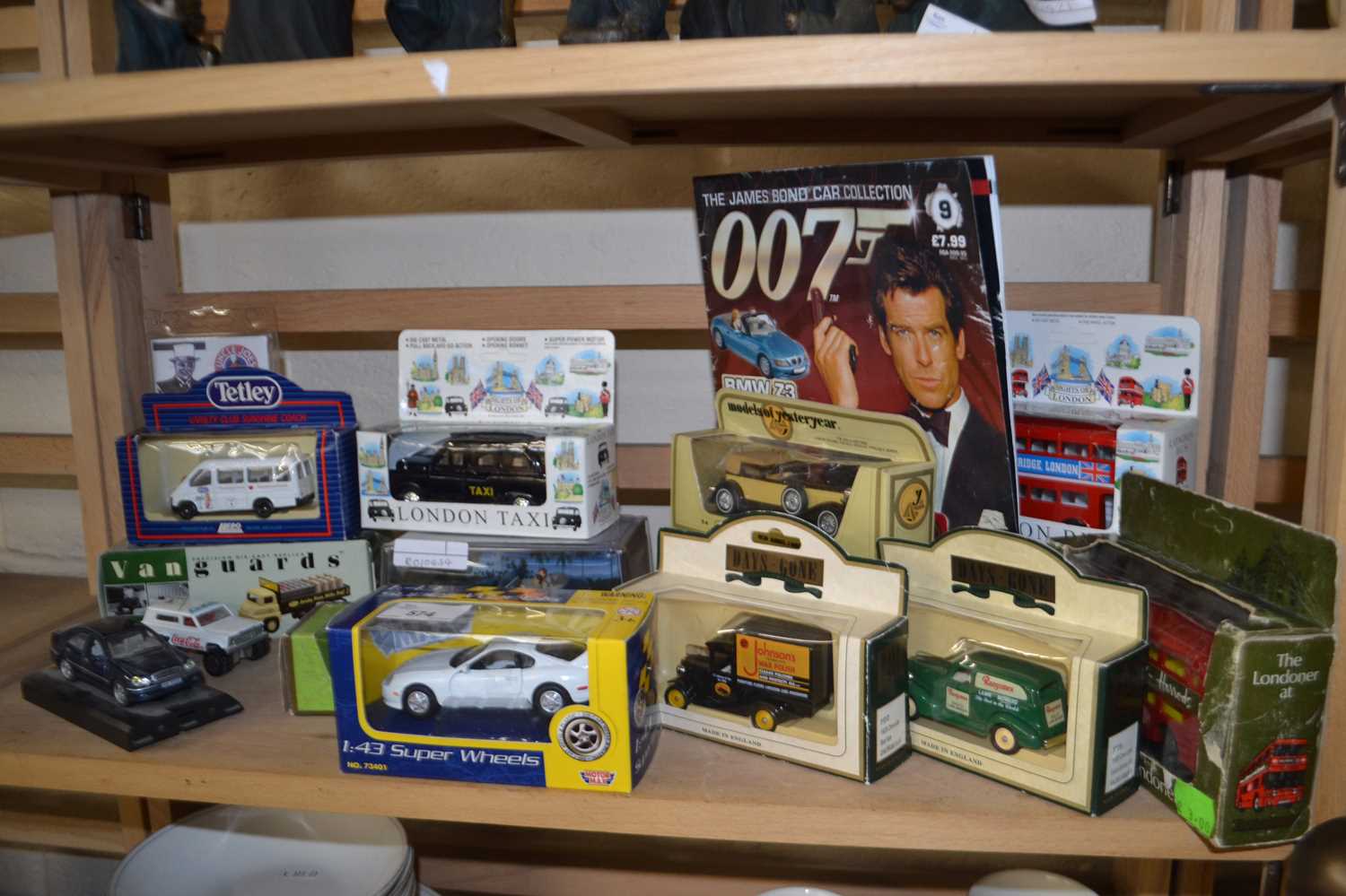 Collection of various boxed toy cars to include James Bond interest, London Taxis, vans etc