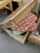 A wicker laundry hamper together with a quantity of assorted cushions, textiles, tea wares etc