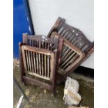 Two folding wooden garden chairs