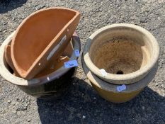 Three stone ware planters together with a pair of terracotta wall pockets