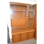 Mid to late 20th Century cabinet with glazed cupboard and shelves and drop down flap above with