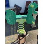 A children's outdoor spring mounted rocking horse