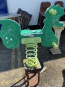 A children's outdoor spring mounted rocking horse