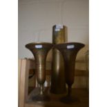 A pair of Indian brass vases together with a brass shell case