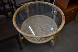 Glass topped round bamboo and wicker conservatory table, approx 81cm diameter