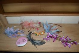 A collection of various feather hair pieces