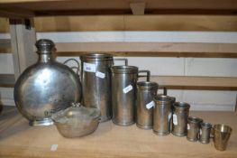 Mixed Lot: Graduated pewter measures together with further pewter flask and a miniature silver cup