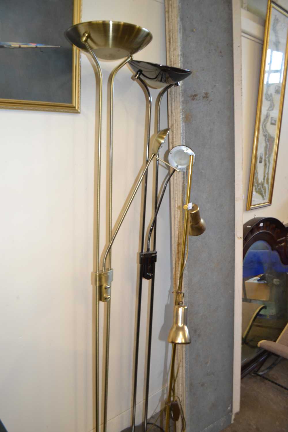 Two uplighters with adjustable lamps and a two light brass effect standard lamp (3)