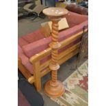 A pine torchere plant stand with turned column