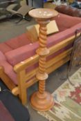 A pine torchere plant stand with turned column