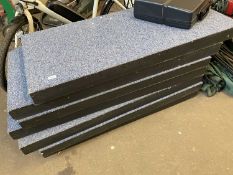 Seven black painted wooden slabs with blue carpet tops, each approx 130cm long, 60cm wide and 8cm