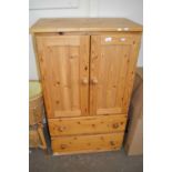 Pine tall boy with cupboards above, two drawers below, 73cm wide