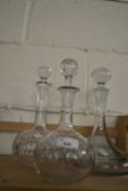 Three various clear glass decanters