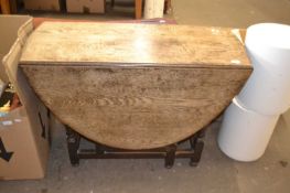 Oak drop leaf dining table, approx 104cm wide