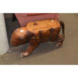 A carved wooden big cat style side table