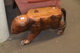A carved wooden big cat style side table