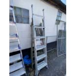 Two aluminium folding step ladders together with a wooden step ladder