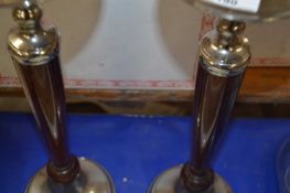 Pair of hardwood and metal mounted candle stands