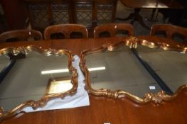 Pair of modern wall mirrors with shaped foliate frames with gilt effect finish, 106cm wide