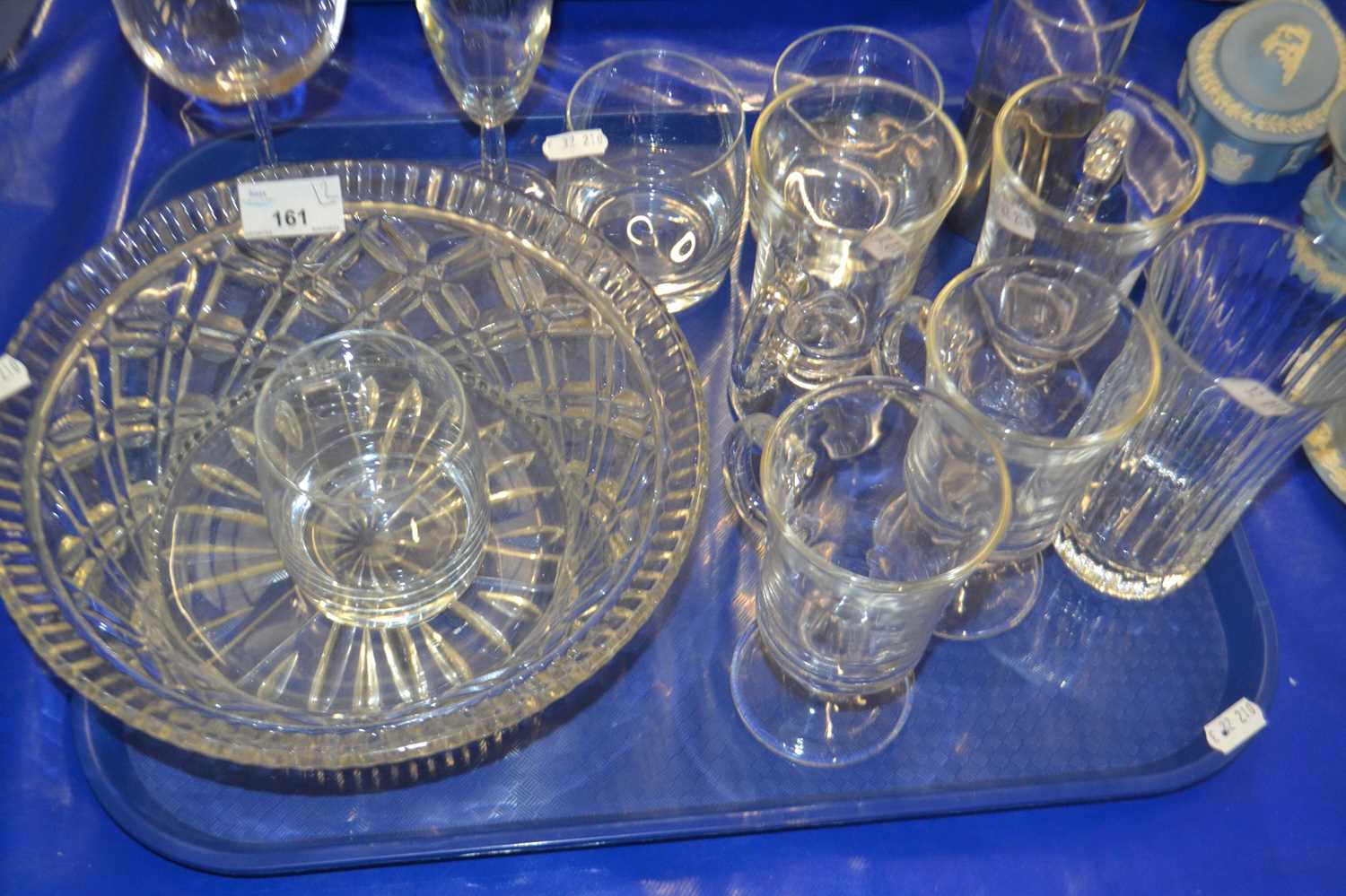 Two trays of various modern drinking glasses