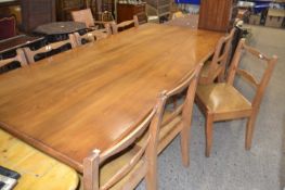 Mid 20th Century oak refectory style dining table together with a set of eight bar back chairs,
