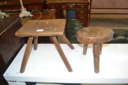 Two vintage elm topped milking stools, largest 30cm wide
