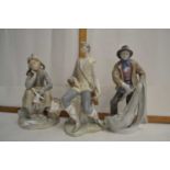 Lladro figure of a girl with a basket together with a further Lladro figure of a seated figure and