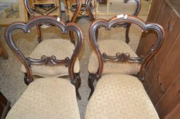 Set of four Victorian rosewood balloon back dining chairs