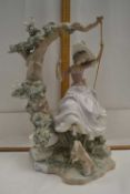 Large Lladro model of a lady on a swing