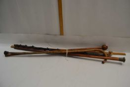 Mixed Lot: Walking sticks to include a Knobkerrie type example, a further white metal topped example