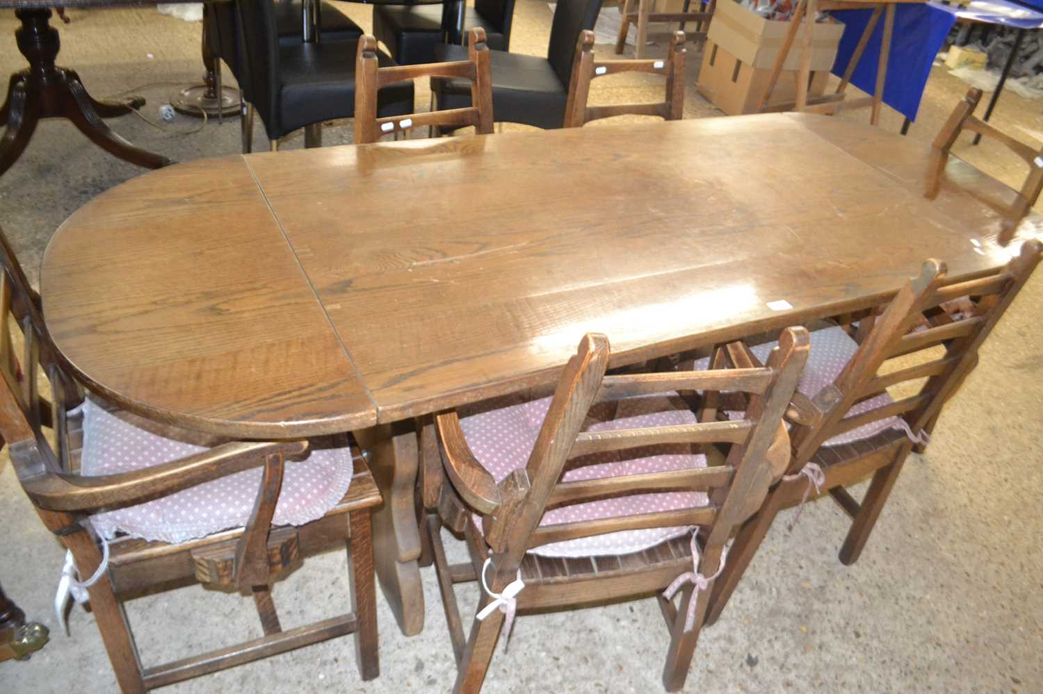 Modern oak drop leaf dining table with a set of six ladder back dining chairs