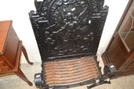 Cast iron fire back and accompanying grate