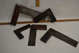 Box of various vintage wood working set squares