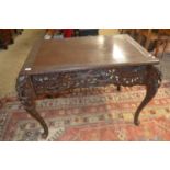 20th Century Chinese side table with pierced carved frieze and tapering cabriole legs, 110cm wide