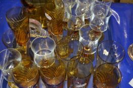 Tray of amber glass lemonade set and other drinking glasses