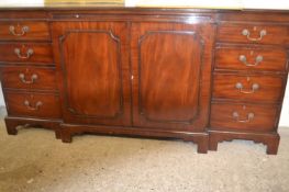 Reproduction mahogany break front sideboard with four doors, two drawers and a pull out central