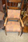 Early 20th Century oak framed and upholstered armchair