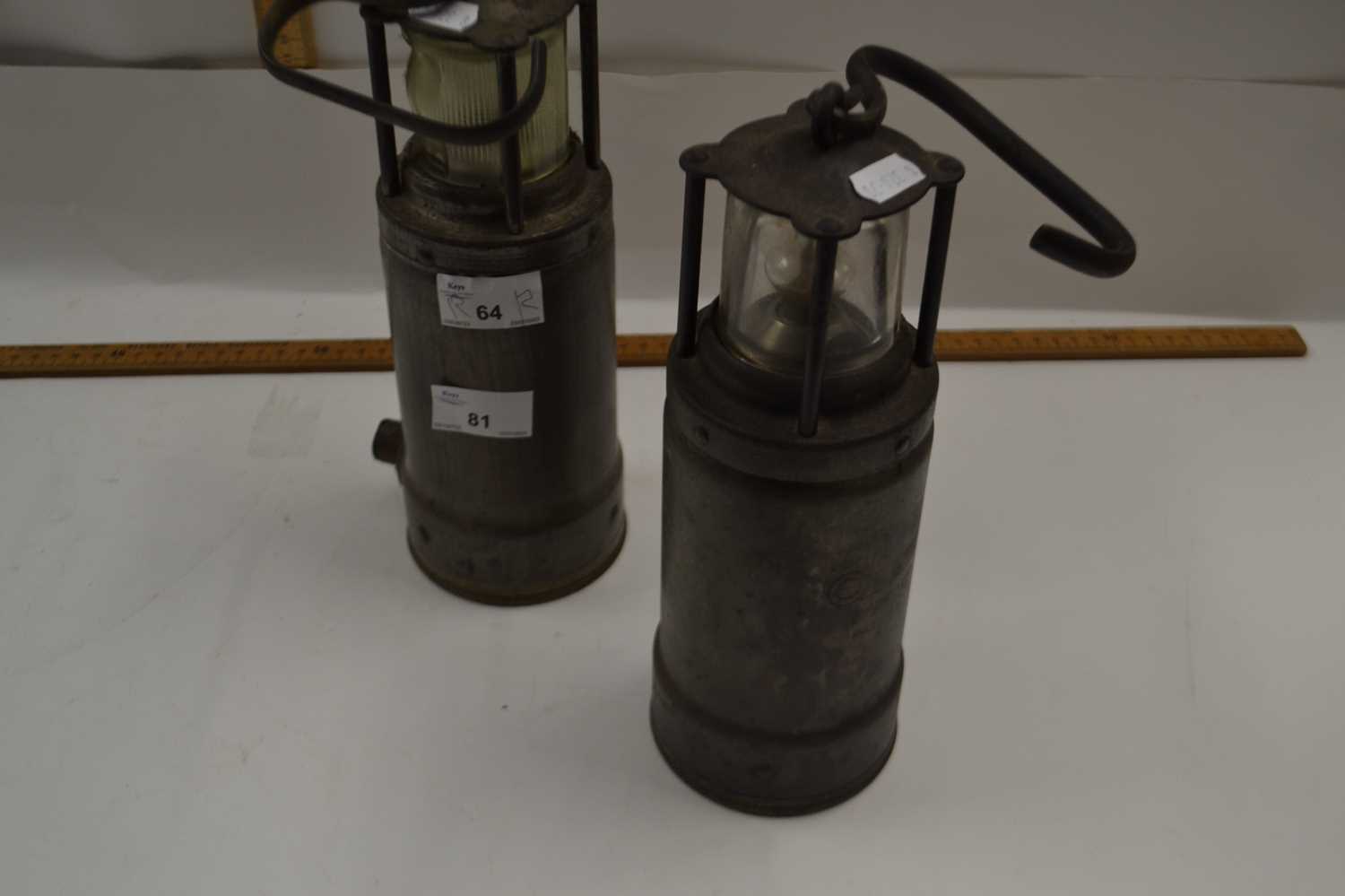 Two vintage ships lamps, one marked LDHAM Patent the other marked Admiralty Patent 8115M