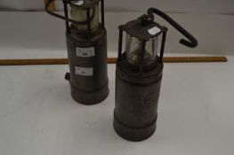 Two vintage ships lamps, one marked LDHAM Patent the other marked Admiralty Patent 8115M