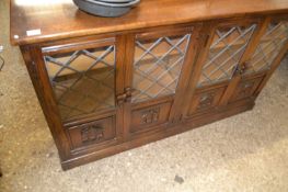 Reproduction oak four door bookcase cabinet with lead glazed doors, 140cm wide