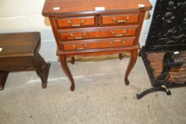 Small reproduction four drawer side table