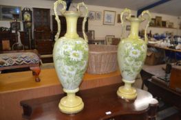 Pair of large floral and gilt decorated double handled vases, 79cm high