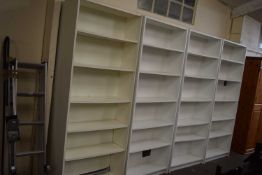 Eight white melamine Ikea style bookshelves together with a similar CD rack (9)