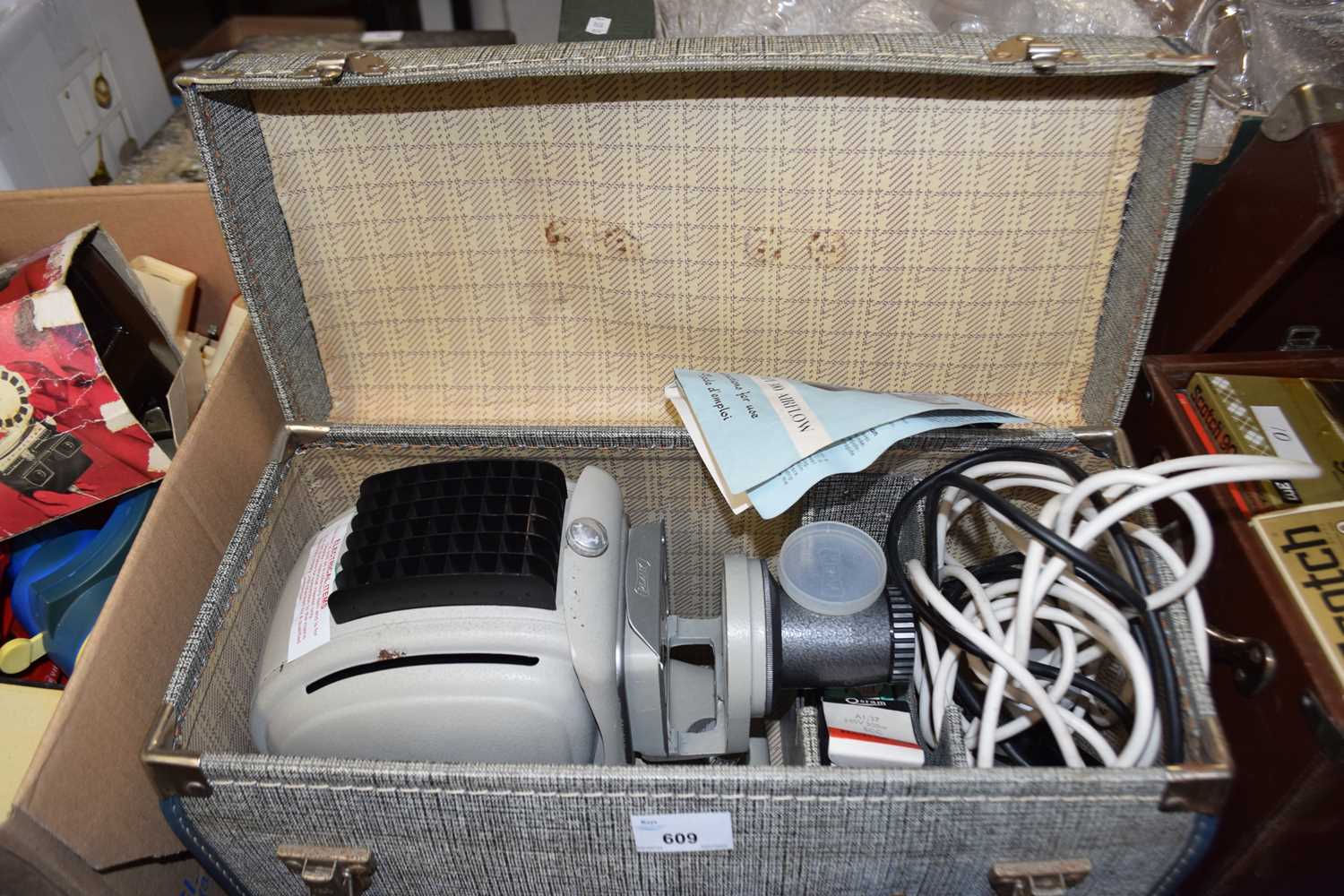 A Norris projector, boxed with assorted accessories