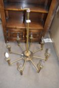 Eight branch brass effect chandelier